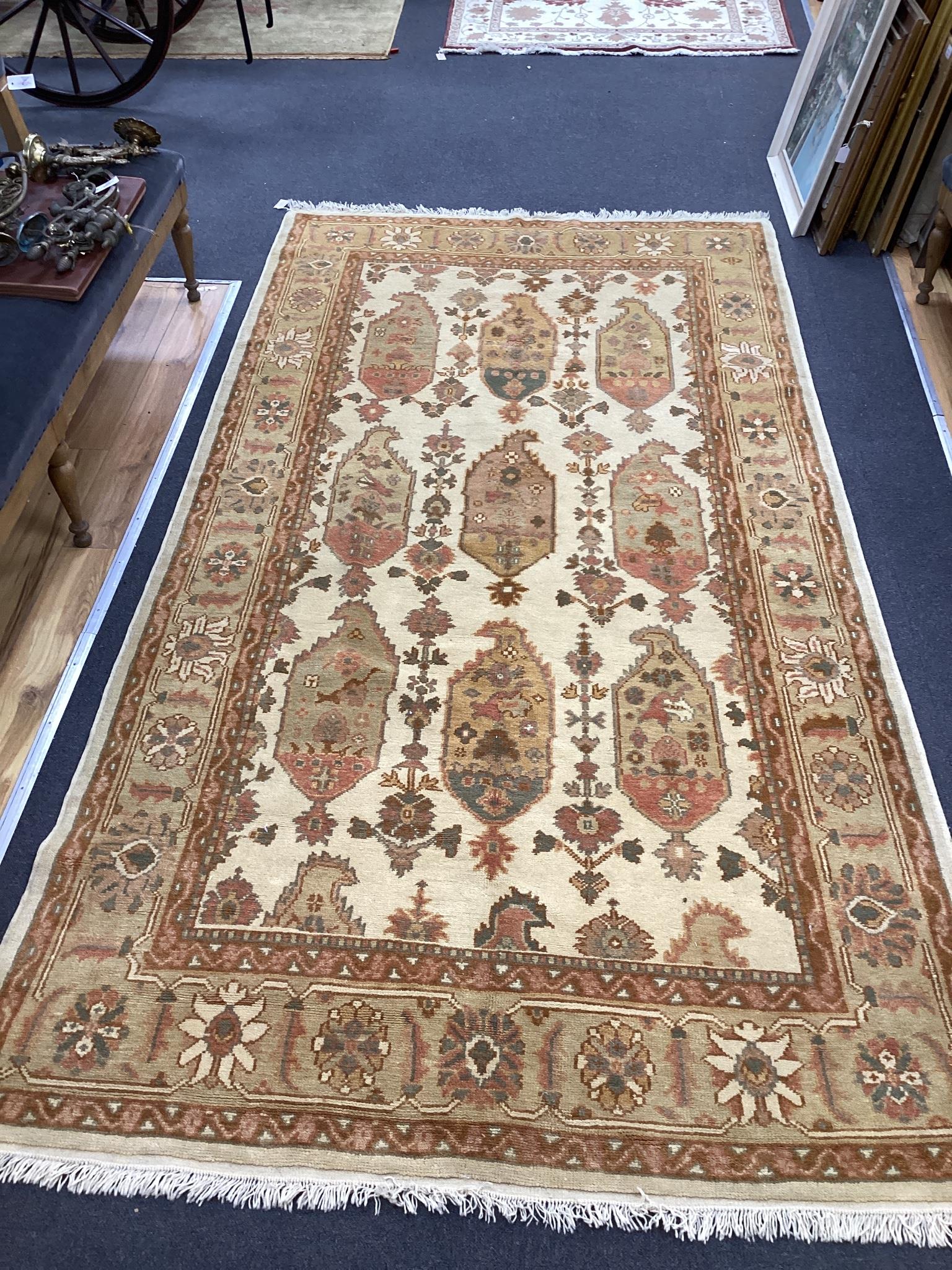 A Turkish ivory ground carpet, 320 x 170cm